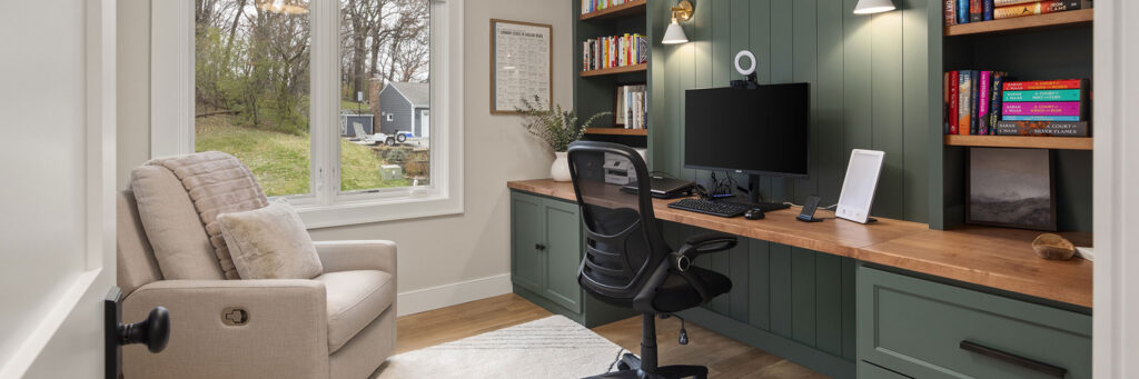 Home office remodel with built-in book shelves and storage by Boyer Building Corporation