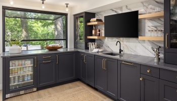 Lower level wet bar with hydraulic pass-through window.