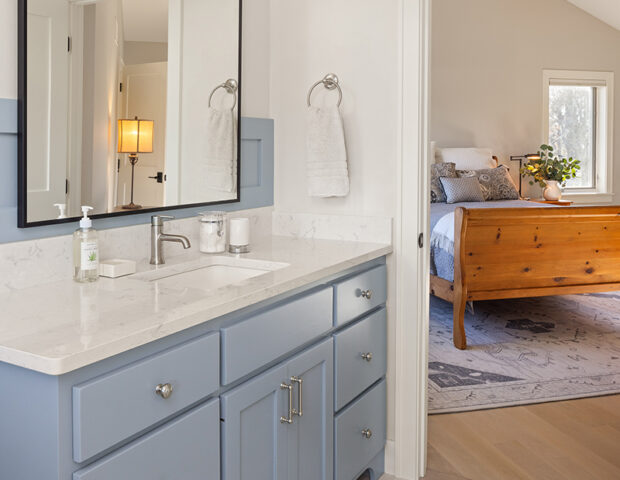 Master bath by Boyer Building showcases blue cabinetry