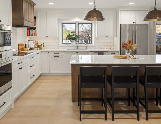 Boyer Building white custom cabinet kitchen with beautiful wood large island.