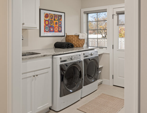 Remodeled main floor laundry room - new floors, paint and trim