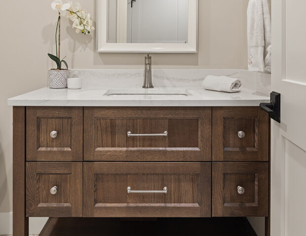 Custom cabinet in main floor guest powder bath with great tiled floor