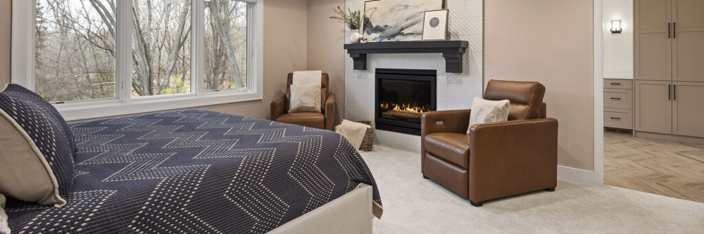 Elegant Bedroom Retreat with Fireplace and Sophisticated Seating