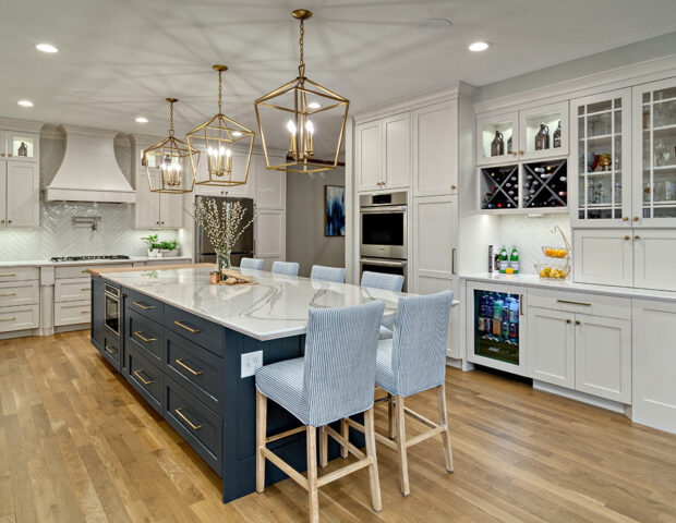 Large remodeled white kitchen with blue island