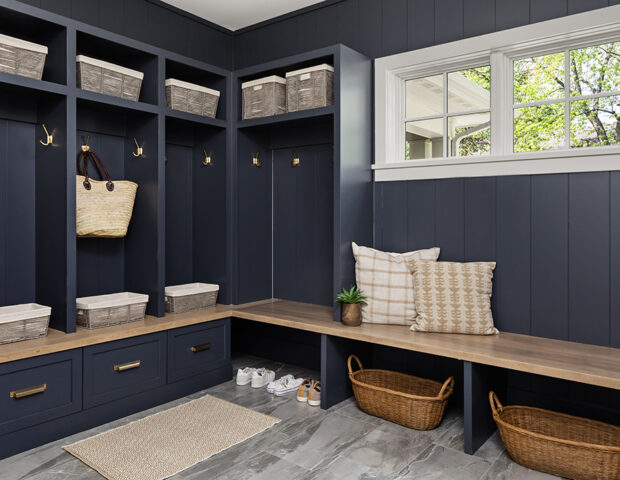 Boyer Building blue mudroom with custom cabinetry as lockers