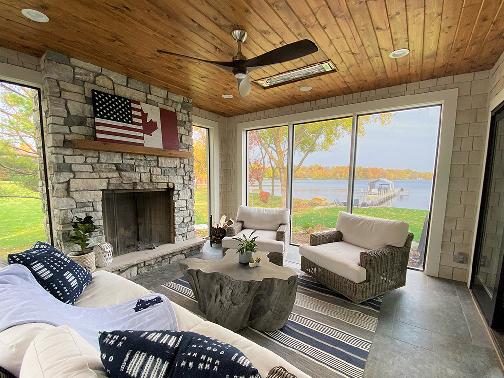 Sun porch with an amazing lake view by Boyer Building Corporation