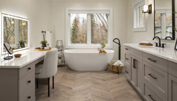 Double vanity and custom cabinetry with vanity and stand alone tub for the master bath.