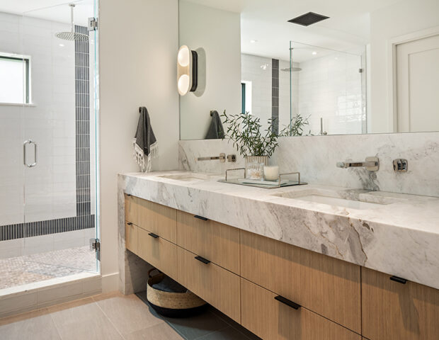 Master vanity with waterfall counter in St Albans Bay Lake Minnetonka Boyer Building Remodel