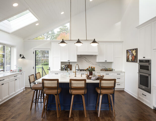 Remodeled white kitchen on Lake Minnetonka with Cambria countertop and backsplash.