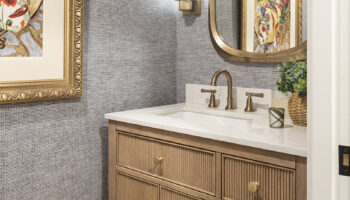 Powder bathroom with blue navy wallpaper