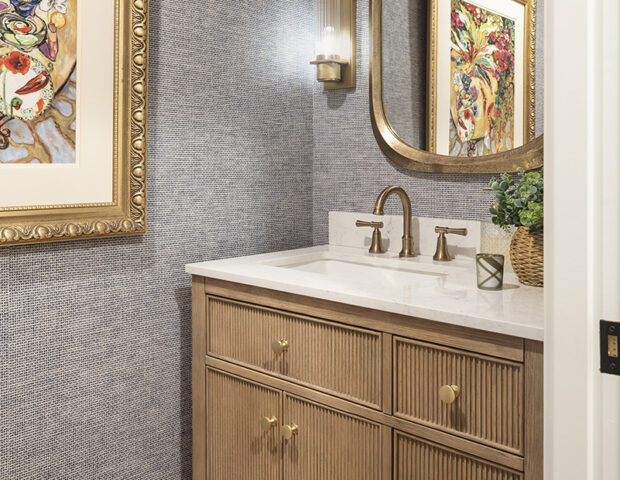 Powder bathroom with blue navy wallpaper