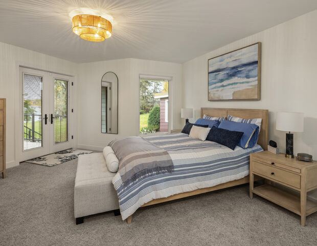 Primary bedroom with additional windows.