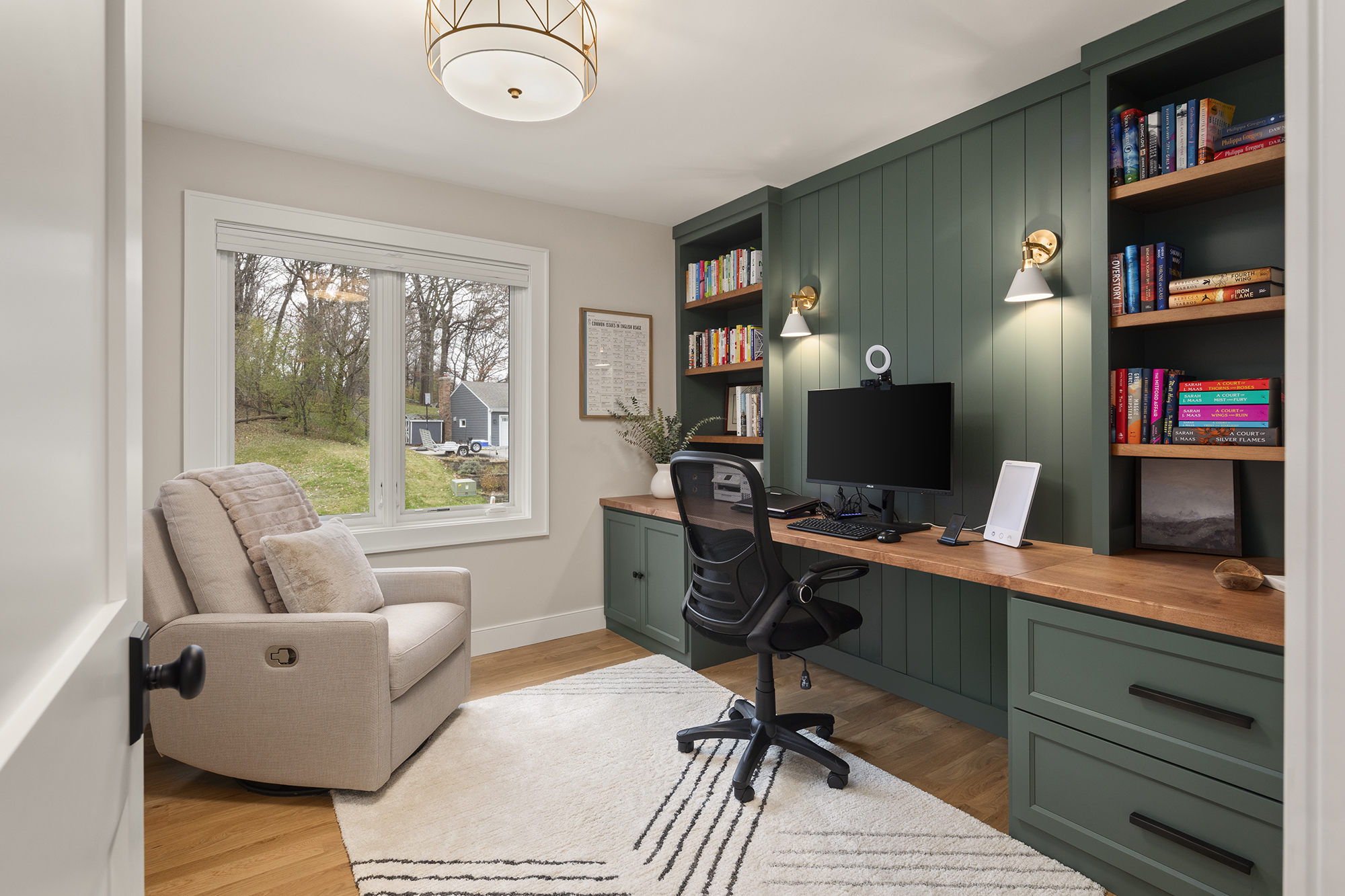 home office with built-ins, desk and storage.
