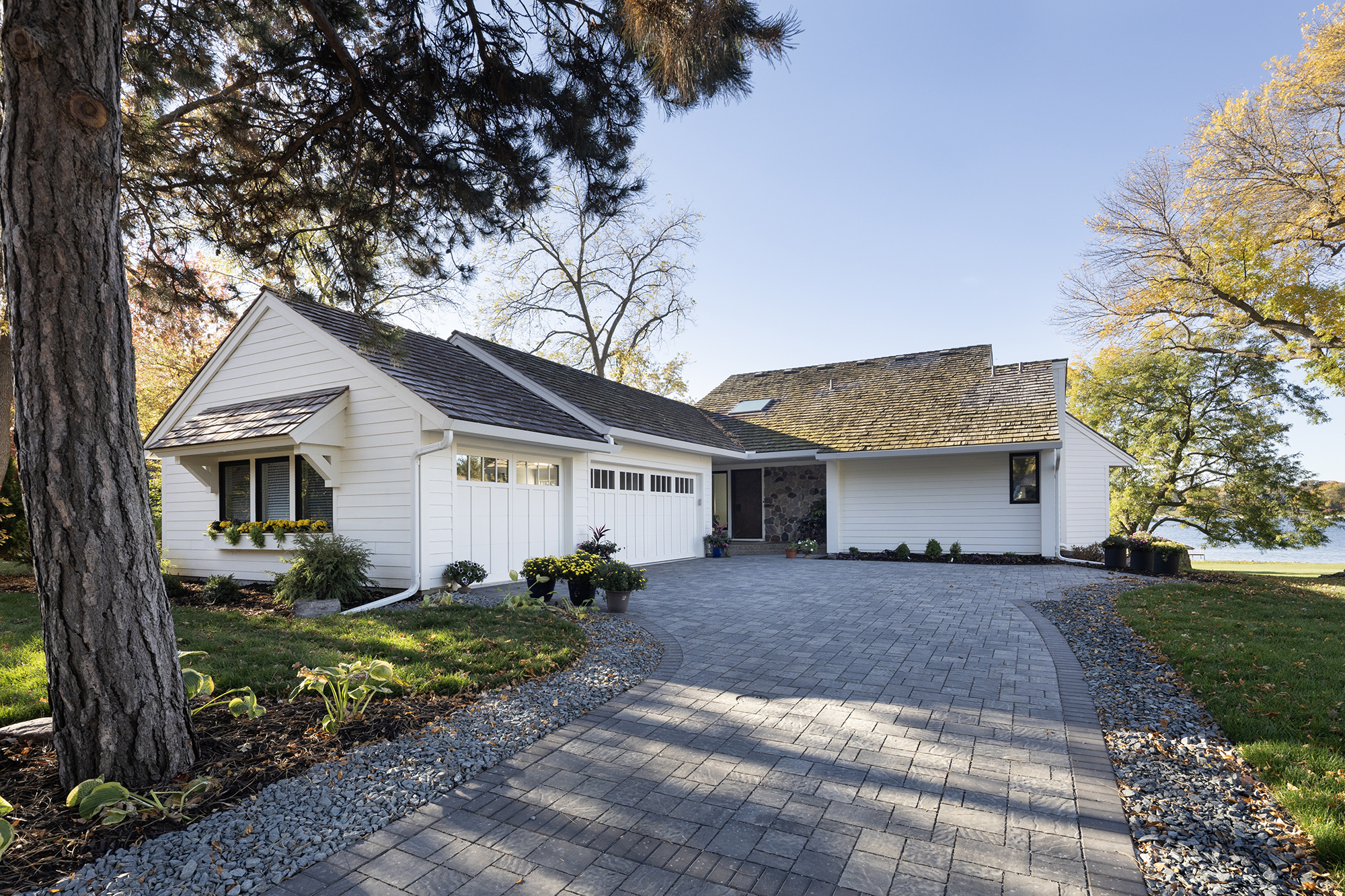 Midcentury modern lake house blending transitional design, natural materials, and expansive water views.