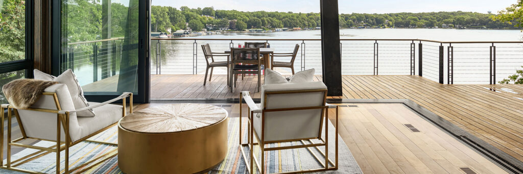 Stunning Lakefront Deck with Weather-Resistant Materials and Comfortable Outdoor Furniture
