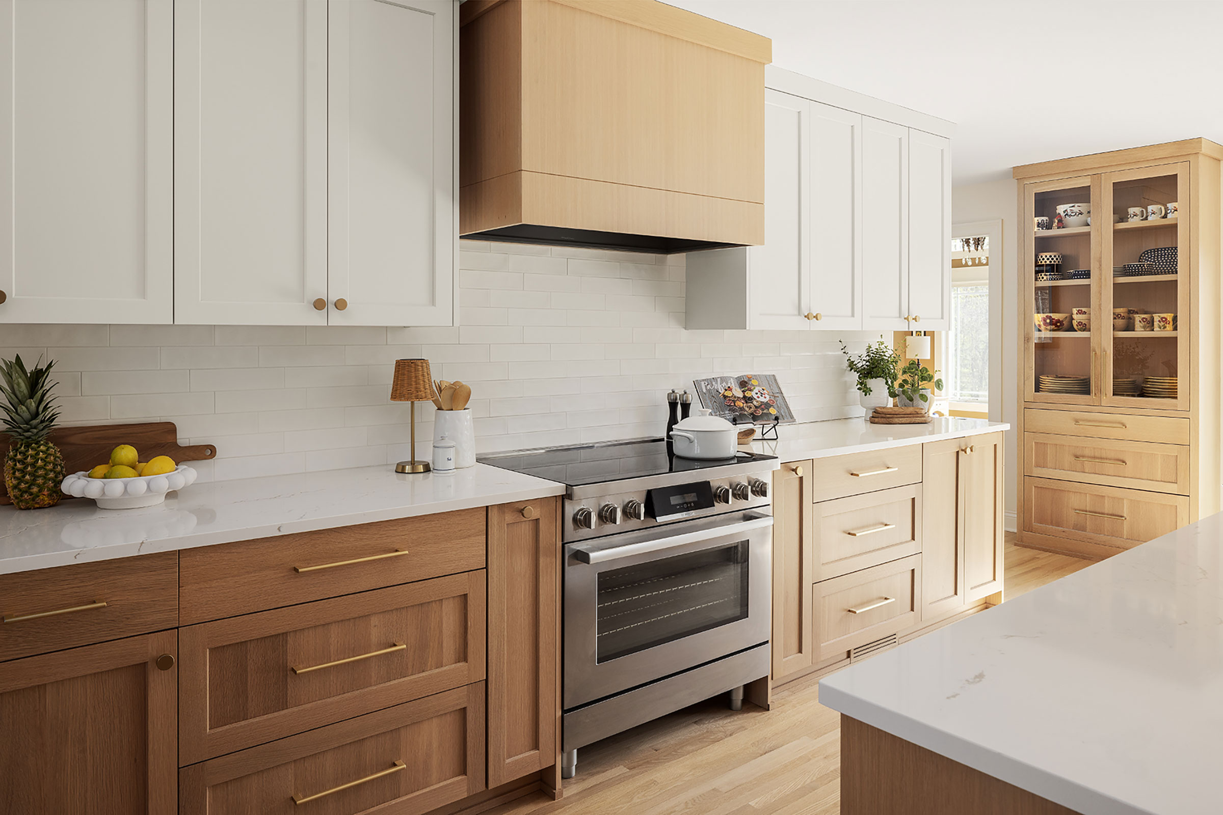 Boyer Building Corporation's Plymouth Scandinavian Kitchen Remodel has beautiful white oak custom cabinetry and white Cambria countertops.