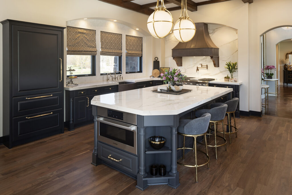 Boyer Building Corporation kitchen gets a face lift with charcoal black painted cabinetry and added vertical tile backsplash.