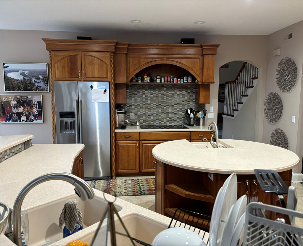 Minnetonka Kitchen BEFORE with its dark cabinetry and circular, non functional island