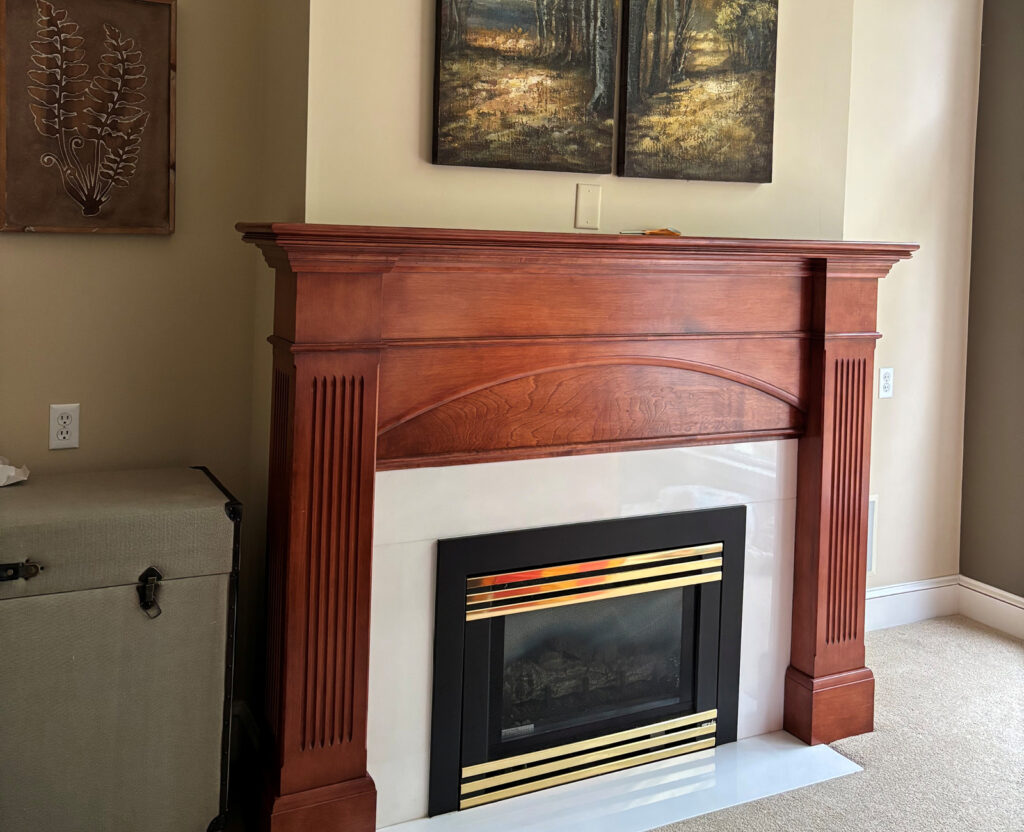Before3 living room outdated fireplace surround and hearth.