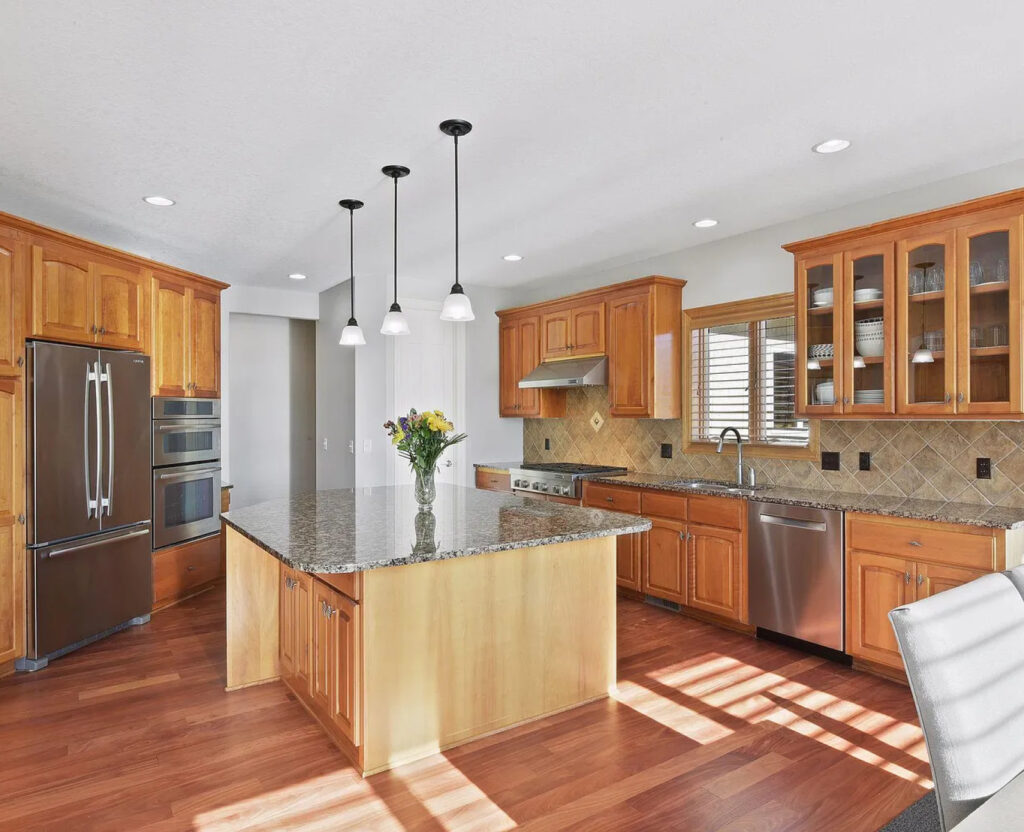 Outdated Eden Prairie Kitchen with dark cabinetry and counters