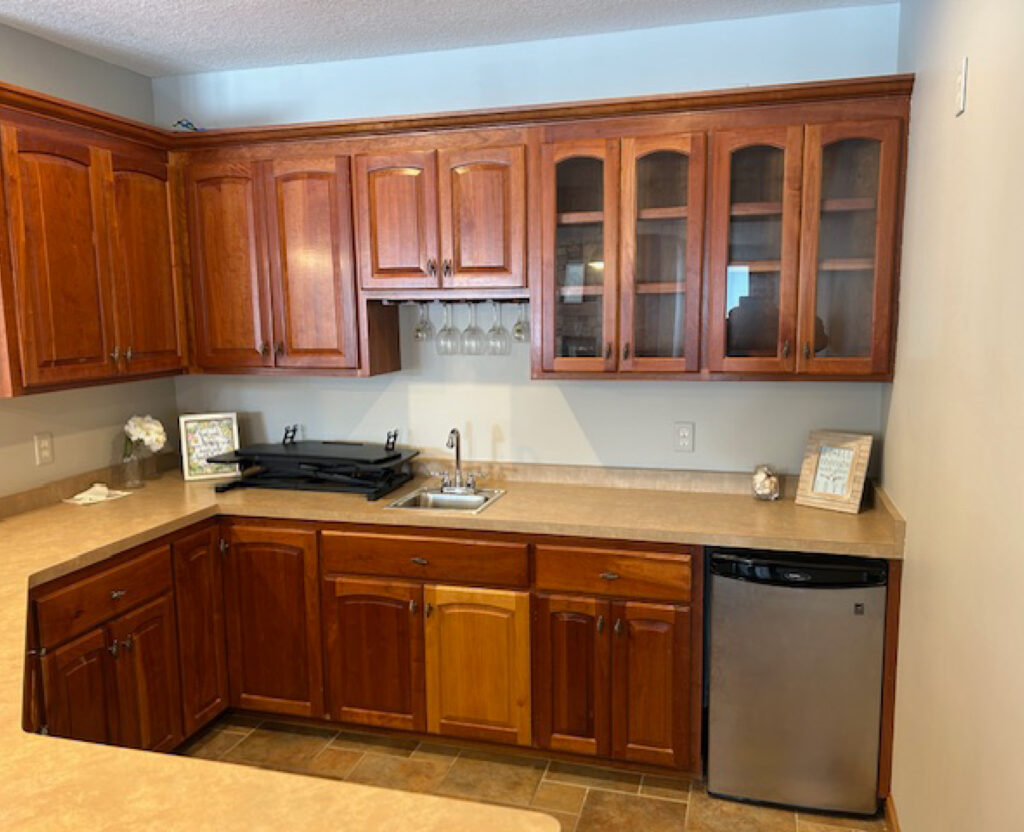 Before kitchenette in LL with dark wood