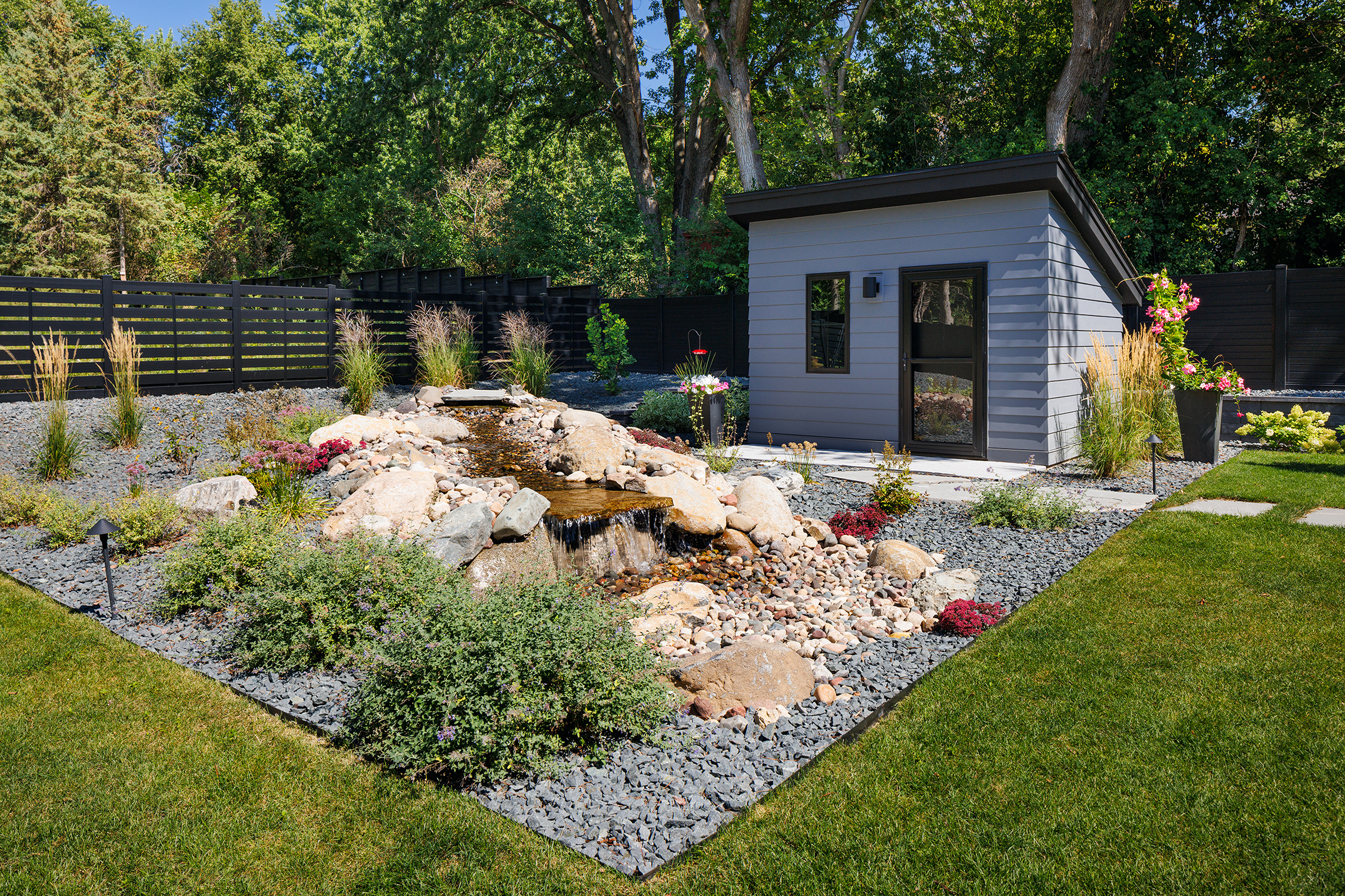 Plymouth Boyer Building Custom Home with custom shed and waterfall landscaping