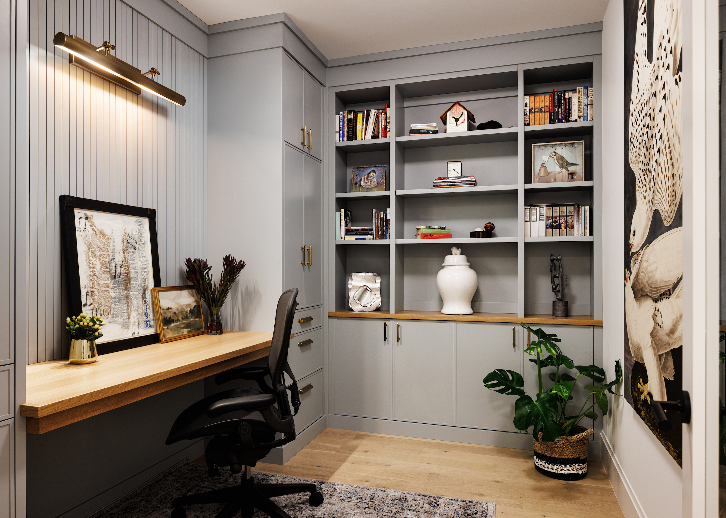 Boyer Building handsome in home office with built in cabinetry and brass gold knobs and overhead light source.