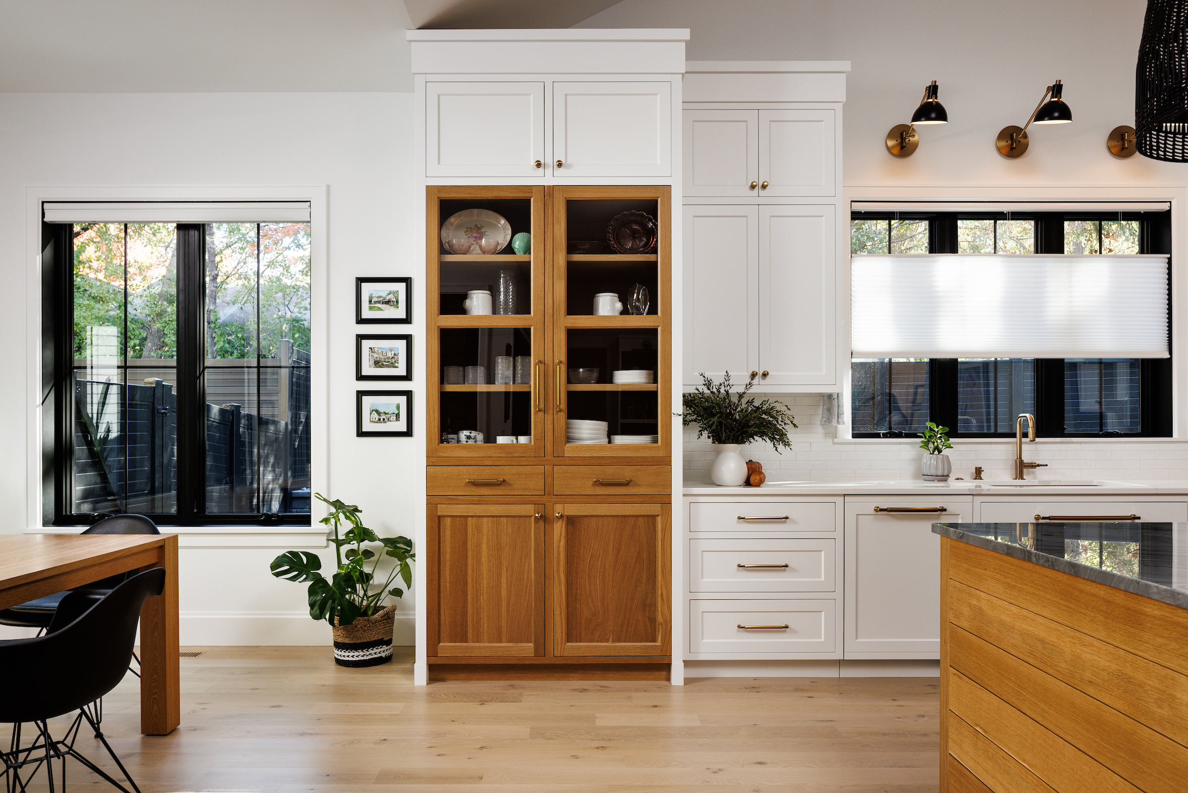 Stand alone pantry integrated into the wall of white cabinetry - Boyer Building Plymouth Custom Home.