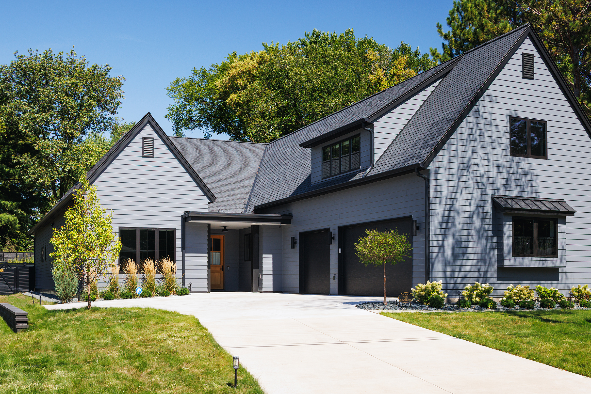 Modern dark colored exterior of Boyer Building custom home.